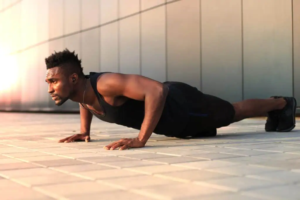 man planking body contouring Chicago