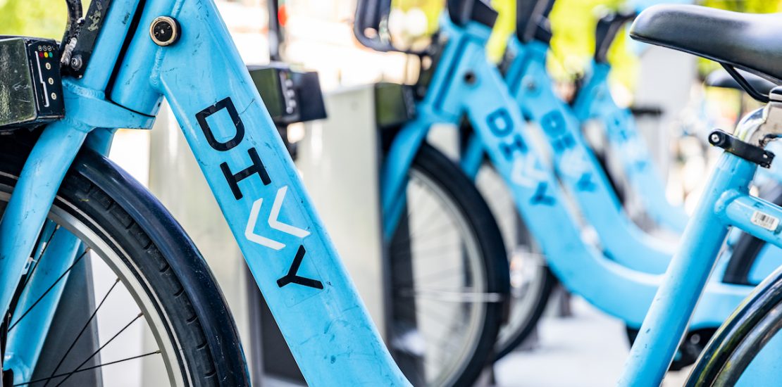 CHICAGO, IL, USA - JUNE 7, 2020: Divvy bikes locked up at a rental kiosk in downtown Chicago. The kiosks are made for people to rent and ride around the city then return to other kiosks.